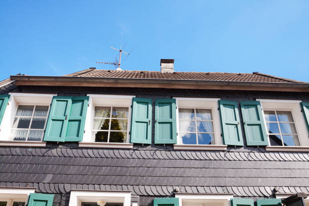 Historical building with schist facade in Muelheim Saarn