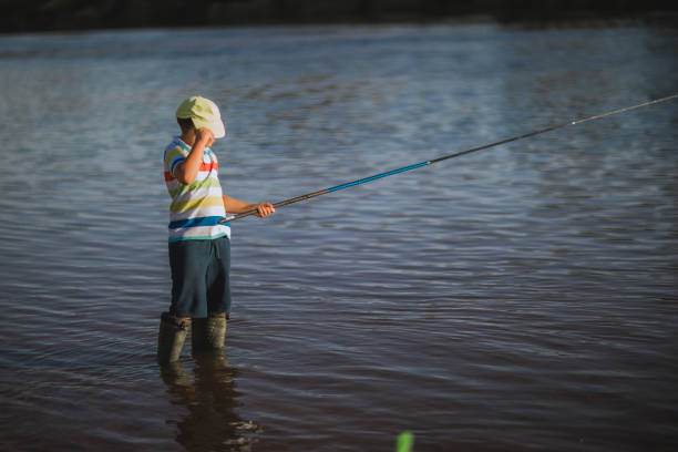 istock A boy fishing on the river 1310577623
