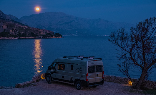 Dalmatia, Croatia - March 15, 2021: camping at Adriatic Sea with modern European campervan conversion
