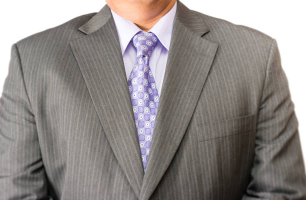 Midsection of businessman pressing his finger on virtual screen in office.