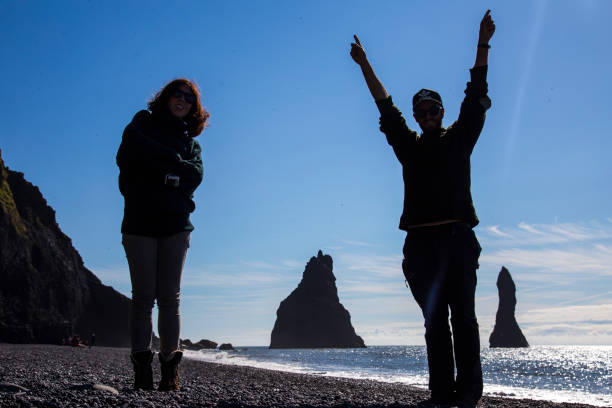istock Reynisdrangar, Iceland »; August 2017: A couple playing at Reynisdrangar beach