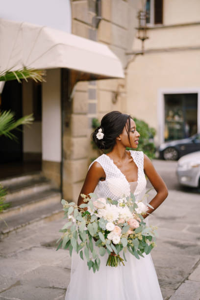 istock Bride With Bouquet Looking Away Outdoors 1310583280