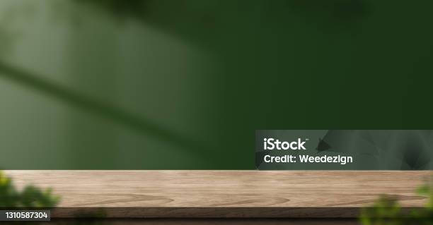Wood Table Green Wall Background With Sunlight Window Create Leaf Shadow On Wall With Blur Indoor Green Plant Foregroundpanoramic Banner Mockup For Display Of Producteco Friendly Interior Concept Stock Photo - Download Image Now