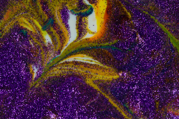 istock Multicolored acrylic backdrop sprinkled with purple sparkles. Contemporary creativity. Colorful avant-garde rich texture. A background made up of many shapes and materials. 1310589666