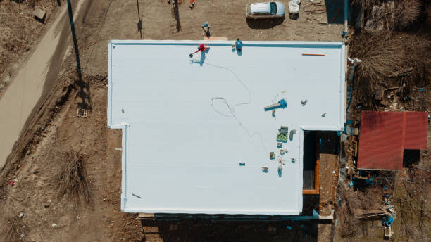 Aerial view of an apartment building with flat roof in construction, ballasted system with geotextile, PVC or EPDM membrane Aerial view of an apartment building with flat roof in construction, ballasted system with geotextile, PVC or EPDM membrane pvc stock pictures, royalty-free photos & images