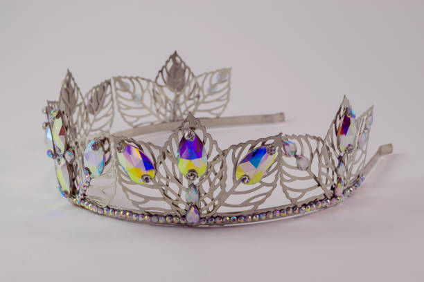 istock Crown on a white background, handmade, custom, individually, princess jewelry. Foreground. For girls. beautifully. fashion. Right view