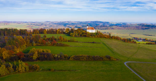 istock Autumn Czech landscape with church 1310592075
