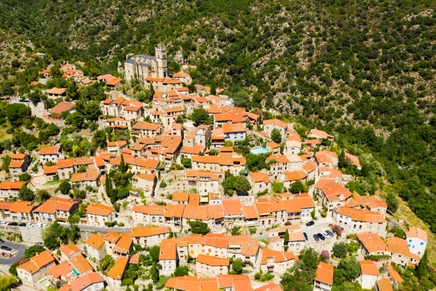 istock Panoramic view from above on the city Eus. Small town located on high mountain. Eastern Pyrenees 1310592139