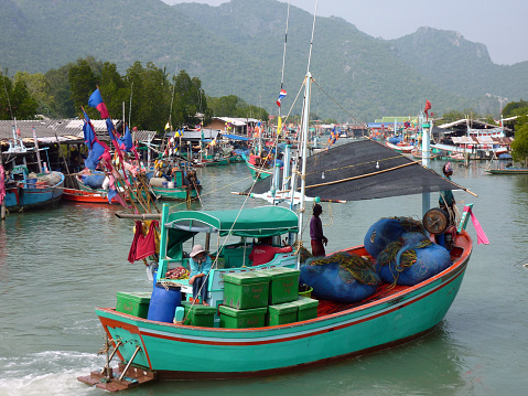 Fishing boats on the river at Bang Pu village, Khao Sam Roi Yot national park, Thailand