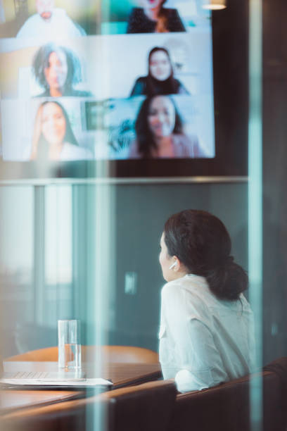 istock Businesswoman talks with colleagues during virtual meeting 1310592613