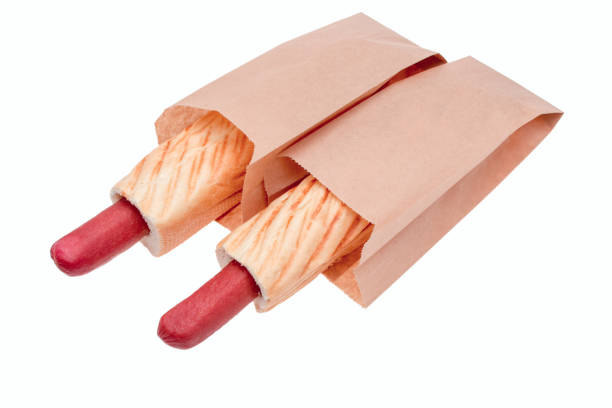istock Bun with sausage in a paper bag 1310594150