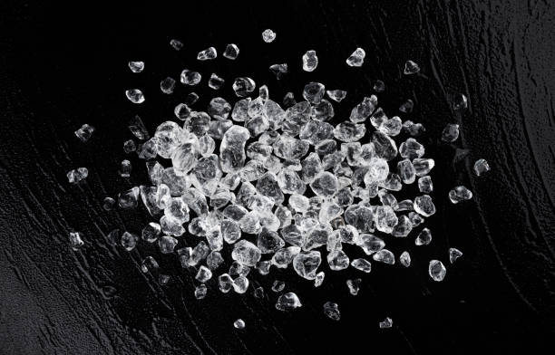 istock Crushed ice on black stone background, top view 1310594694
