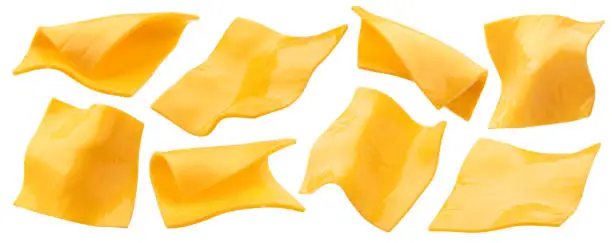 Square slices of processed cheese isolated on white background with clipping path