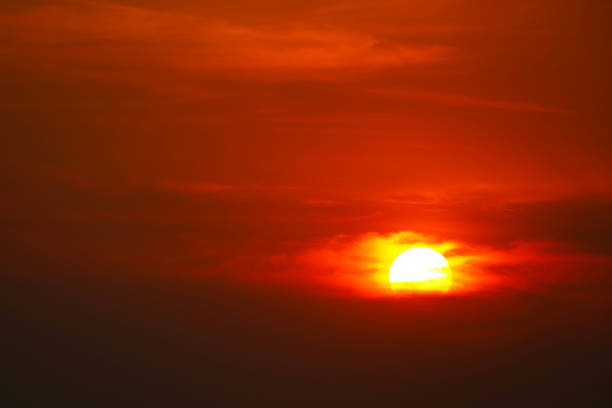 istock beautiful sunset orange yellow red silhouette dark sky in back on cloud 1310595872