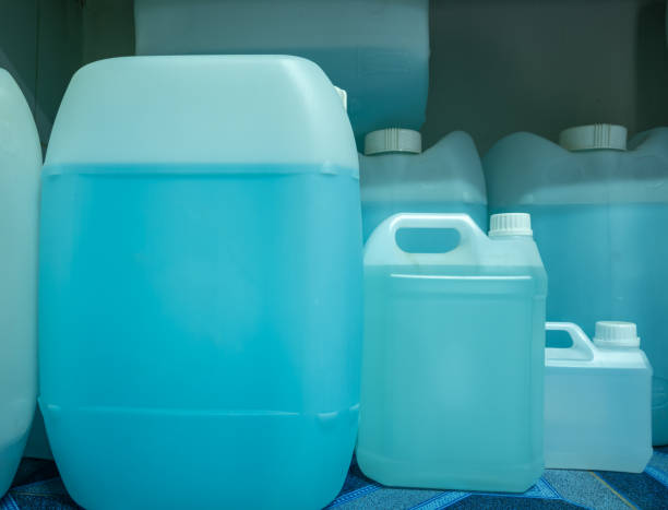 istock Blue ethyl alcohol, contained in large and small gallons 1310595950