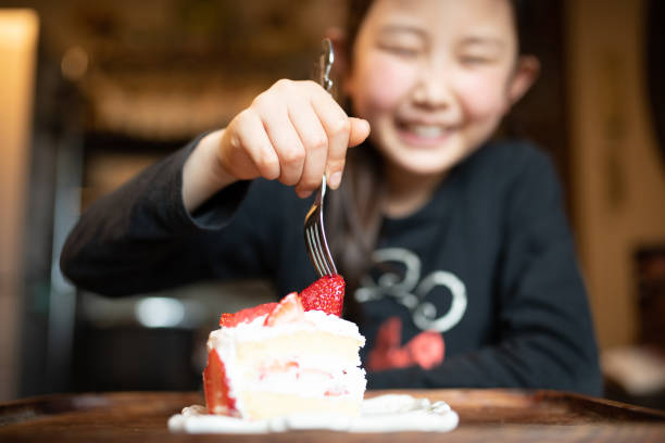 Child eating birthday cake