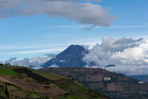 Volcanic landscape with hills and blue sky, Tungurahua volcano Volcanic landscape with hills and blue sky, Tungurahua volcano mt tungurahua sunset mountain volcano stock pictures, royalty-free photos & images
