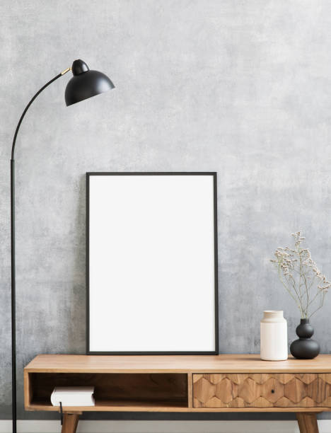 istock Blank picture frames mockup on a grey wall. Artwork showcase in a living room 1310597503