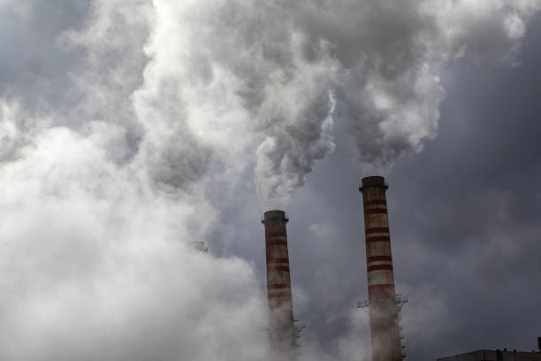 istock Factory chimneys pollute the air, thick dirty smoke 1310598655