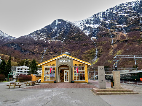 Flam, Norway - January 24, 2017: Norwegian fjord and mountain landscapes in Norway next to Flam Railway Museum and the Flamsbana locomotive.
