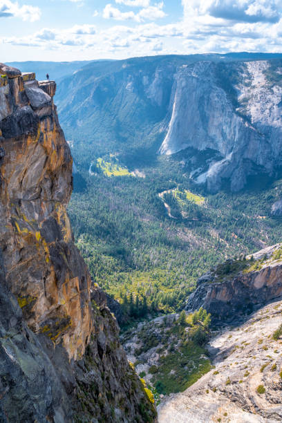 A young man at the top of Taft point in Yosemite National Park. United States"t A young man at the top of Taft point in Yosemite National Park. United States"t vernal utah stock pictures, royalty-free photos & images