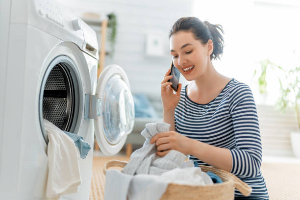 istock woman is doing laundry at home 1310600942