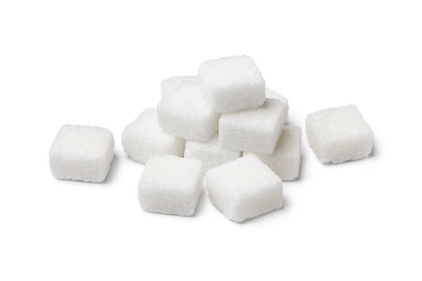 istock Heap of white sugar cubes isolated on white background 1310601032