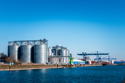 silver colored steel tanks at harbor