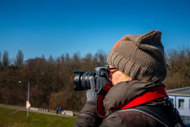 woman with camera taking pictures
