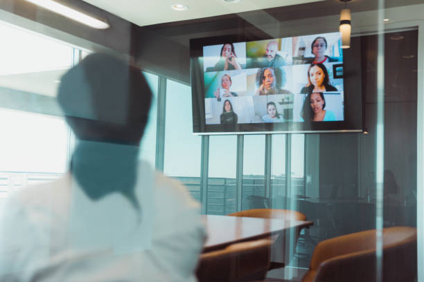 istock Businesswoman meets with colleagues virtually 1310604572