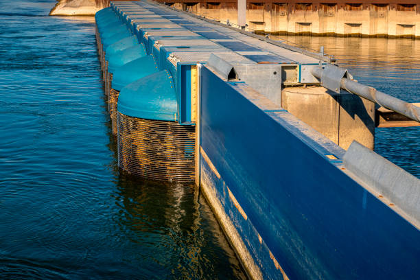 The jetty to the boats is blocked by a wooden gate and metal bars