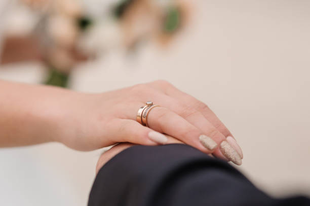 istock The bride is holding the groom's hand 1310606326