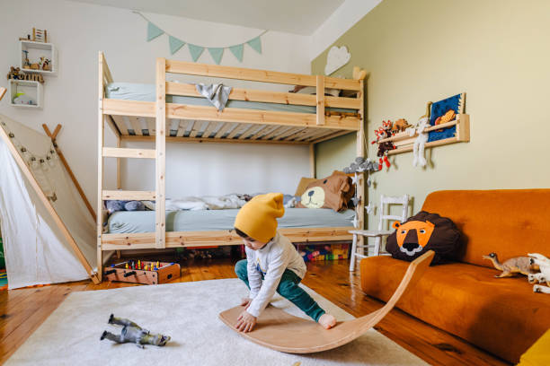 istock Little boy's playing with balance board in his room 1310607214