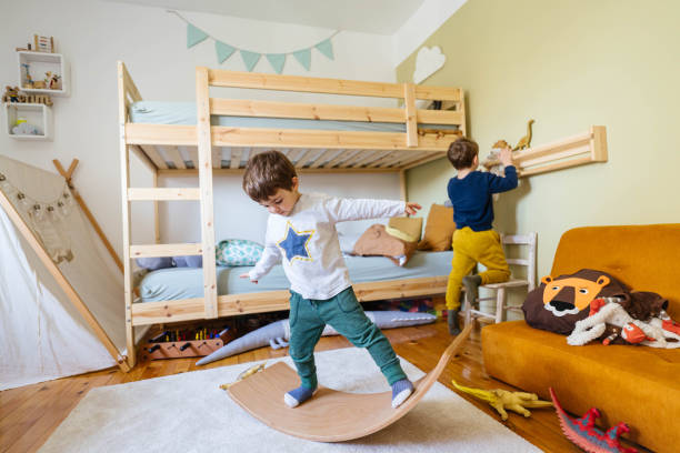 istock Little boy's playing with balance board in his room 1310607234