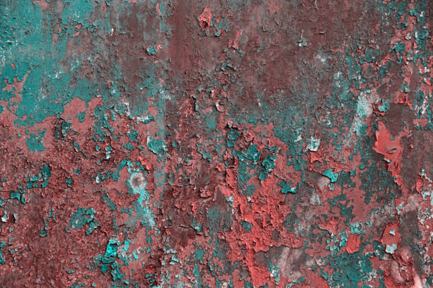 istock Grunge rusted metal texture, covered with old colored paint, rust and oxidized metal background 1310608652