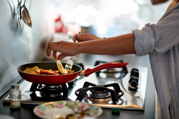 istock A young girl preparing a meal in the kitchen. Breakfast, kitchen, home 1310608657