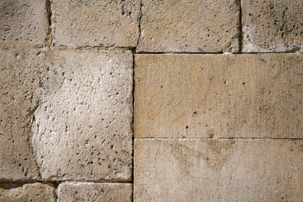 istock Weathered sand-lime stone as a brick partially repaired 1310609507