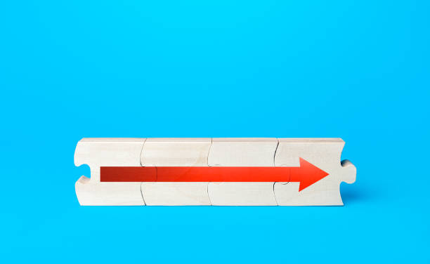 istock Assembled puzzle with a red arrow. Continuation of process, further progress. Moving forward, direction of development. Ensuring growth and expansion. Career growth concept, promotion. Next stage 1310611028