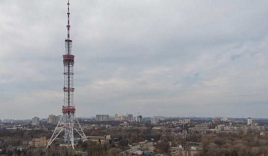 View of the Kiev TV tower against a cloudy sky.