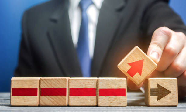 istock Businessman makes changes to the business process on an alternative path. Defining a new action plan and strategy. Revision of business chains structure, improvement of efficiency, reduction in price. 1310612119