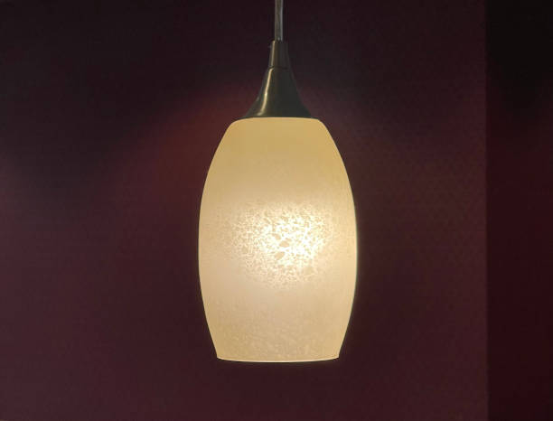 istock Beautiful decorative lamp light with red textured background 1310614864