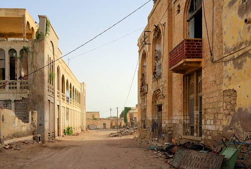 Massawa / Mitsiwa / Massaua, Northern Red Sea Region, Eritrea: crumbling buildings and piles of rubish, Massawa remains a war-ravaged city since 1990 - old town, Massawa island / Batse.