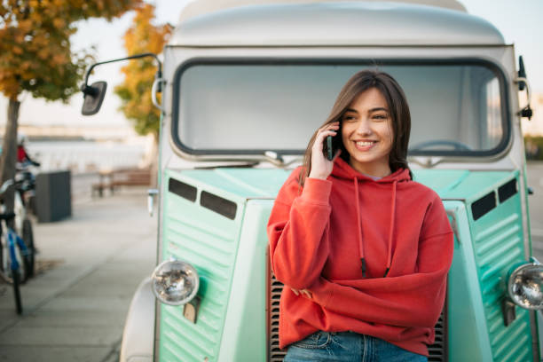 istock Beautiful young Caucasian woman using a smart phone 1310617055