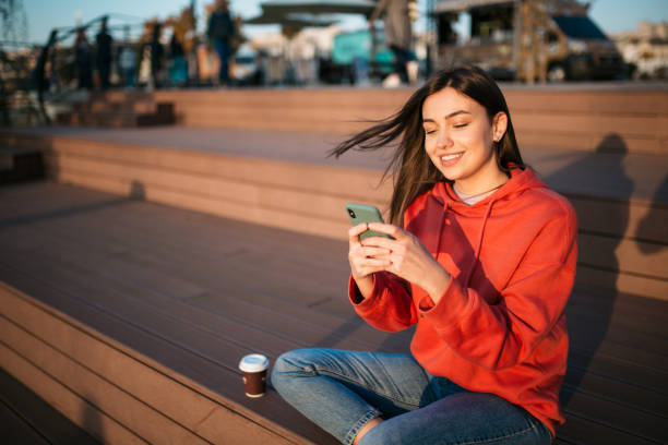 istock Beautiful young Caucasian woman using a smart phone 1310617058