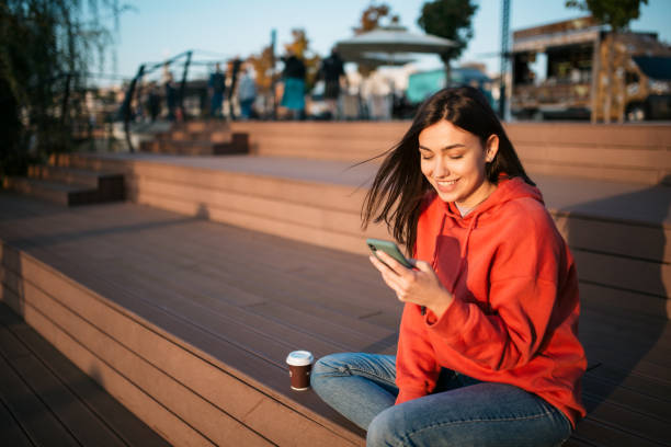 istock Beautiful young Caucasian woman using a smart phone 1310617059