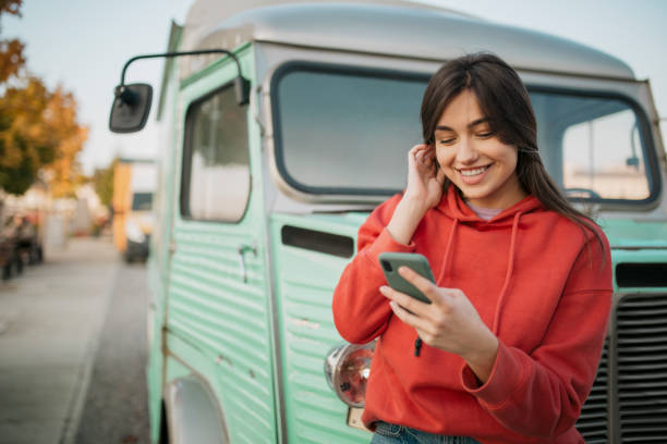 istock Beautiful young Caucasian woman using a smart phone 1310617064