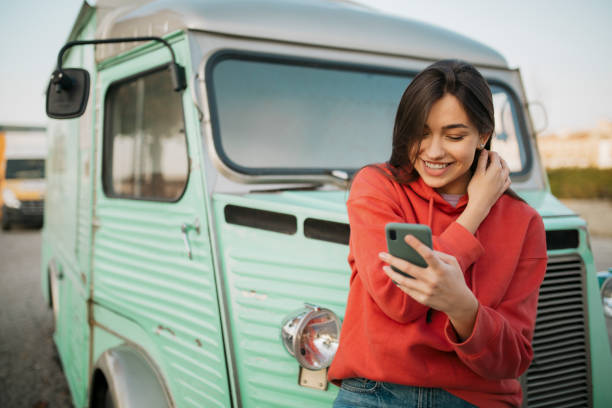 istock Beautiful young Caucasian woman using a smart phone 1310617076