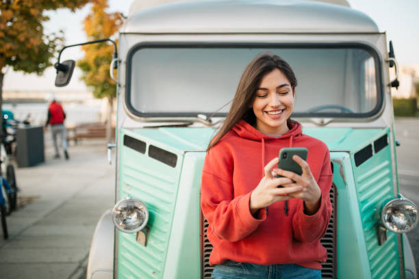 istock Beautiful young Caucasian woman using a smart phone 1310617088