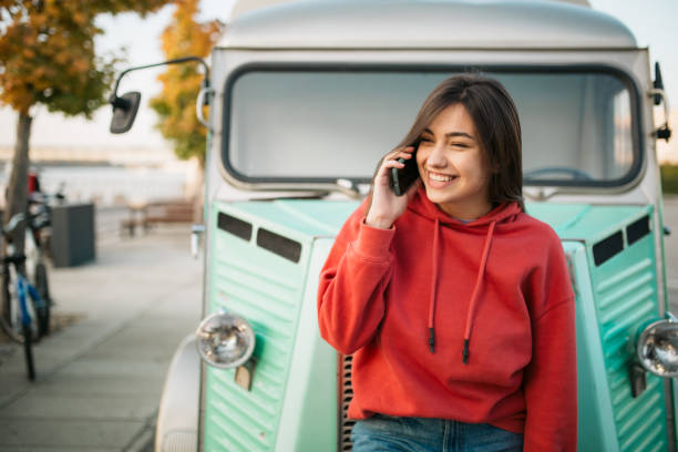 istock Beautiful young Caucasian woman using a smart phone 1310617102