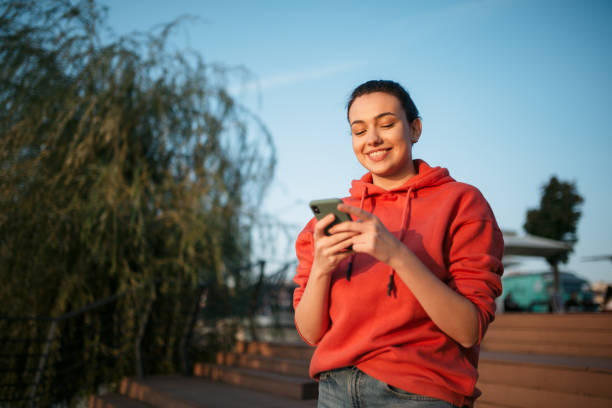istock Beautiful young Caucasian woman using a smart phone 1310617130